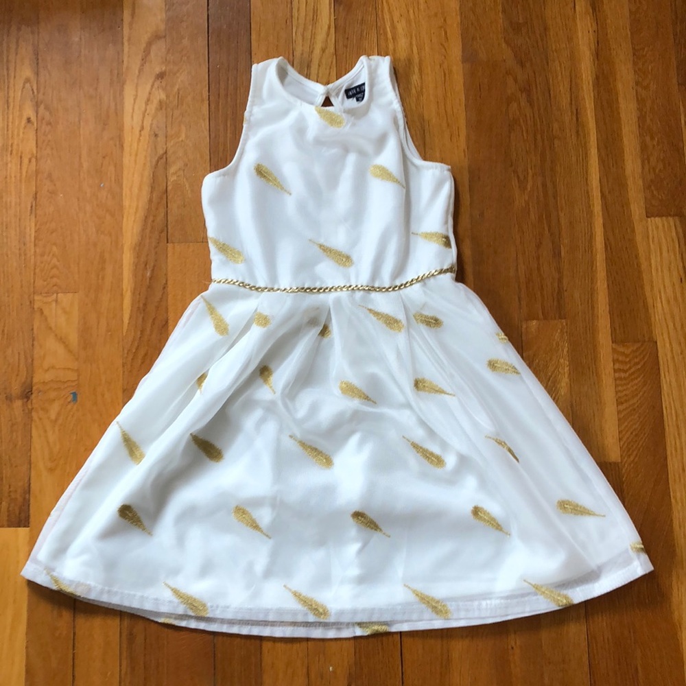 White dress with gold feathers